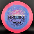 Disc golf driver with pink rim and blue center, fiery “Firebird” graphic