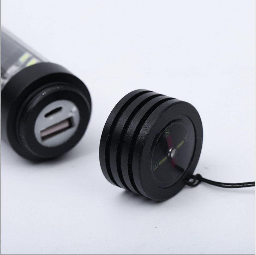 Black flashlight end cap with USB port and wrist cord