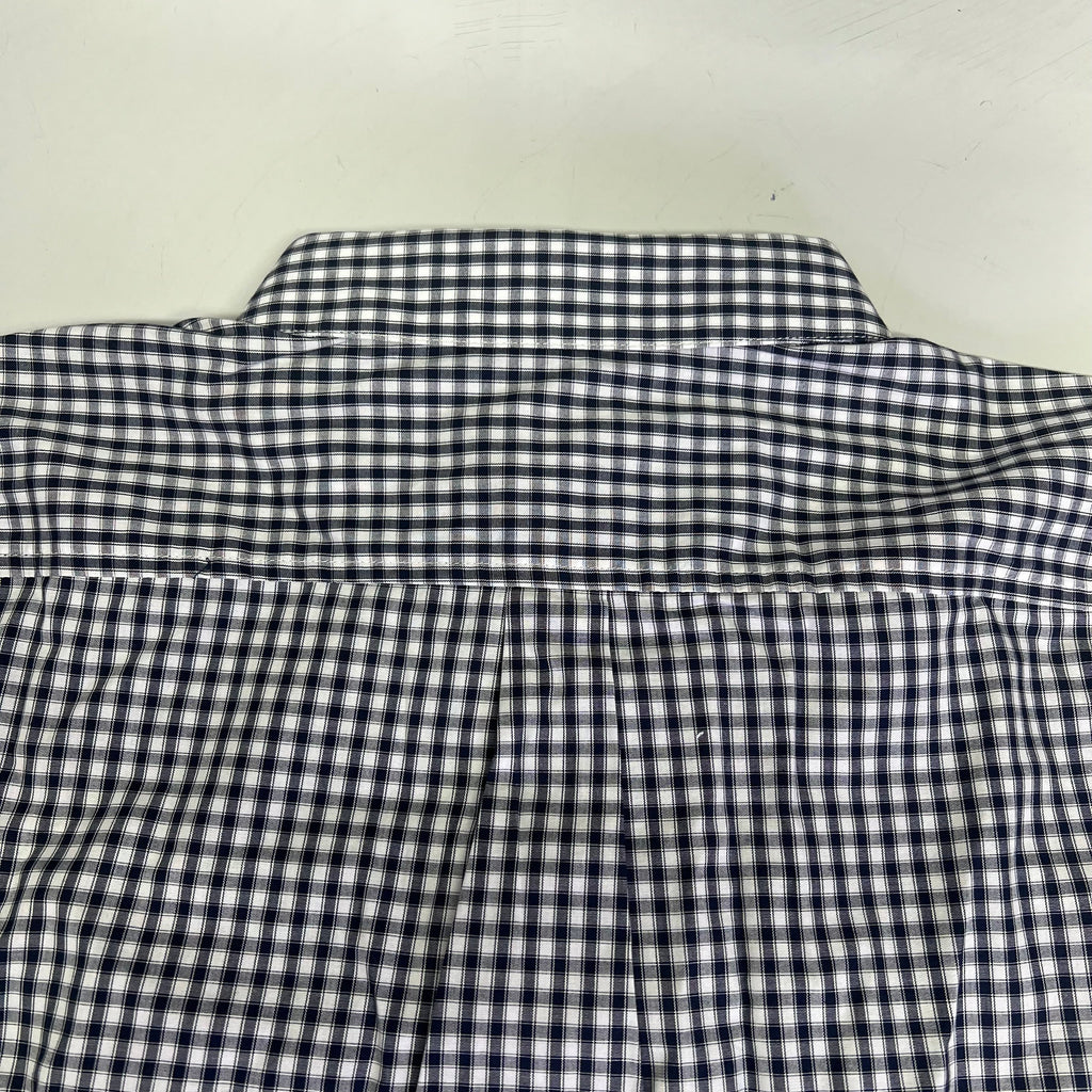 Men's checkered button-up shirt back yoke and pleat seam