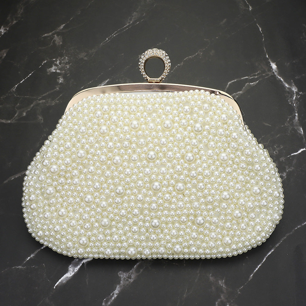 Pearl-embellished satin clutch with beaded design and round jeweled clasp frame, gold-tone
