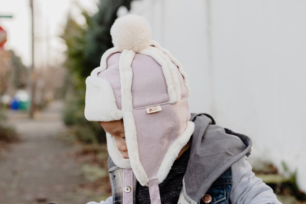 Kids pink and gray trapper hat with white sherpa lining and side ear flaps