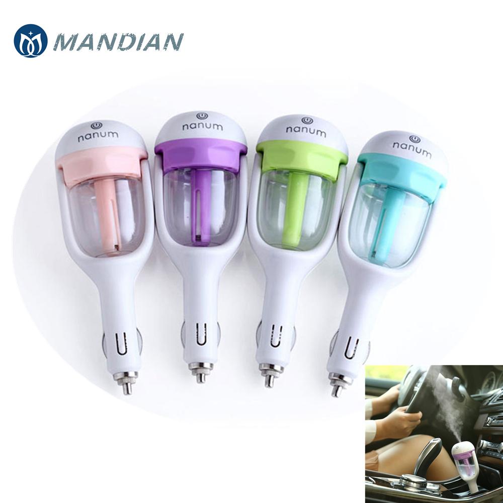 Four mini car aroma diffusers in pink, purple, green, and blue colors