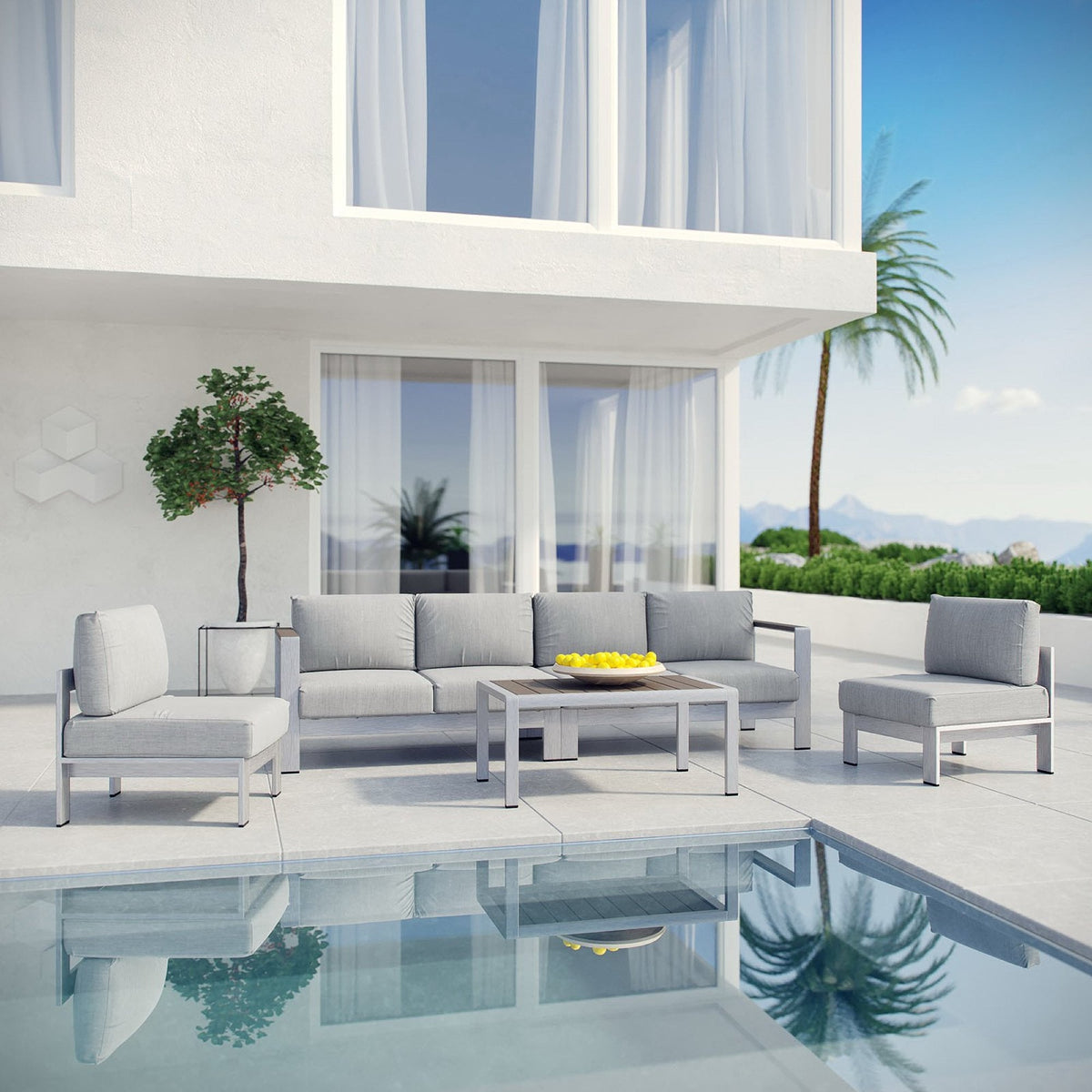 Outdoor patio sectional set with gray cushions, matching chairs, and coffee table