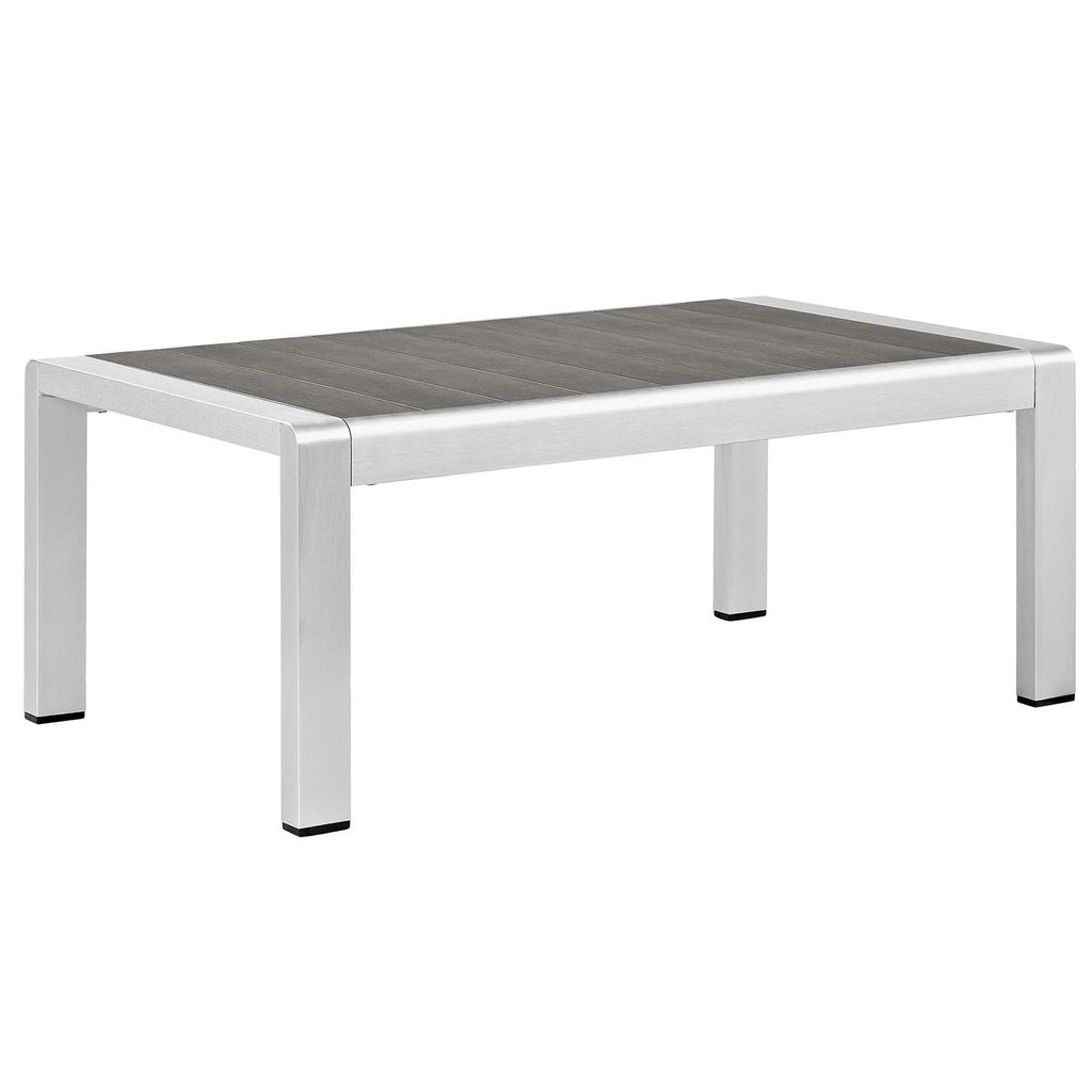 Outdoor aluminum patio coffee table with dark gray slatted top