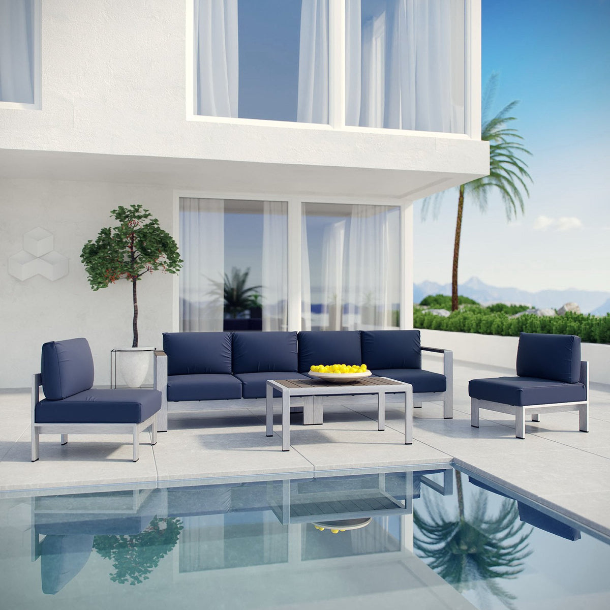 Outdoor patio sectional set with navy cushions, matching chairs, and coffee table