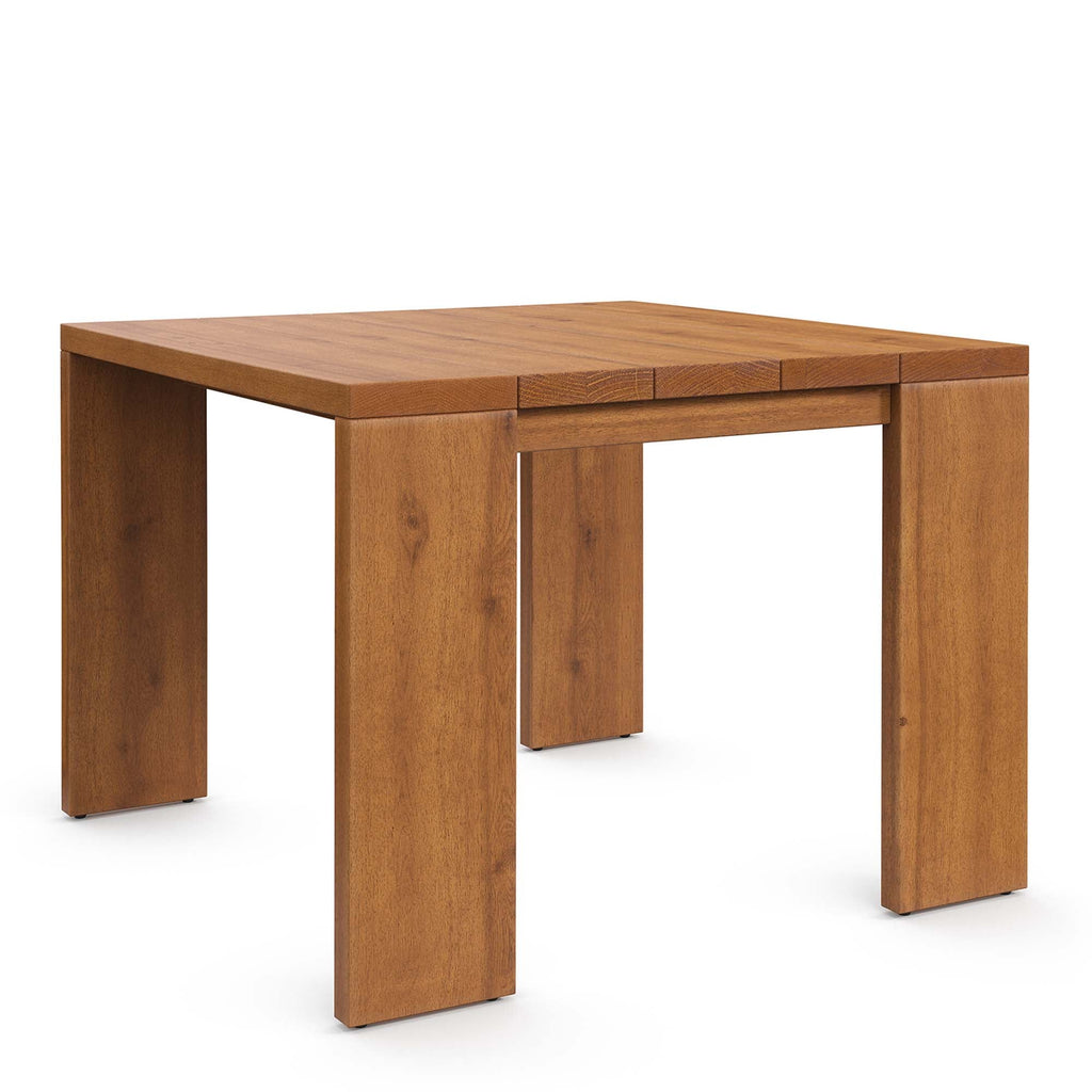 Acacia outdoor coffee table with slatted top, warm wood finish, and block legs