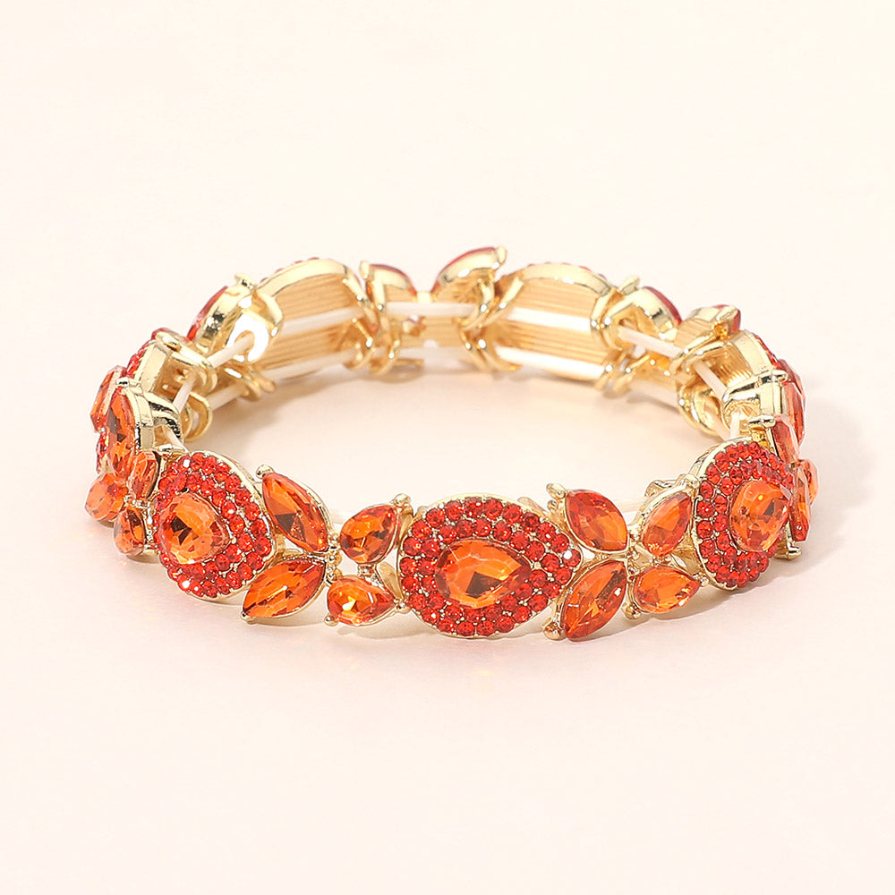Gold stretch bracelet with orange teardrop and marquise stone cluster beads