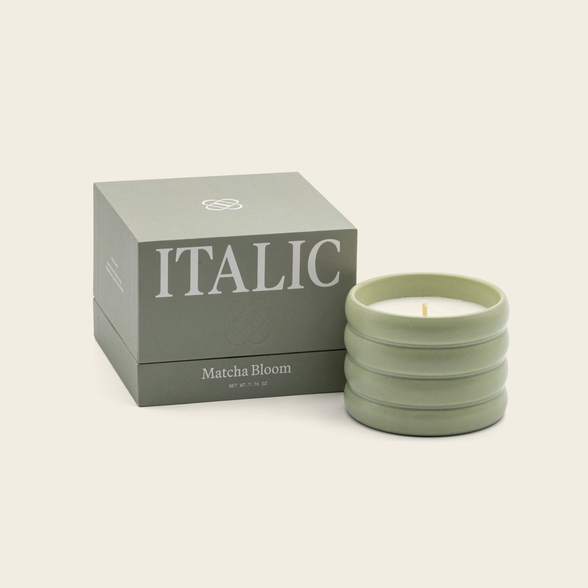 Sage green ceramic soy candle with lit wick and Matcha Bloom gift box set.