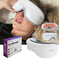 Heated eye massager with gray strap, worn over closed eyes by a person