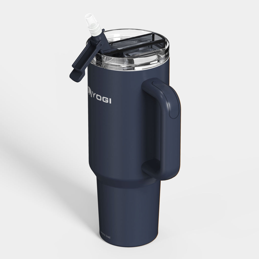 Ceramic-lined dark blue tumbler with clear lid and flip spout, side handle
