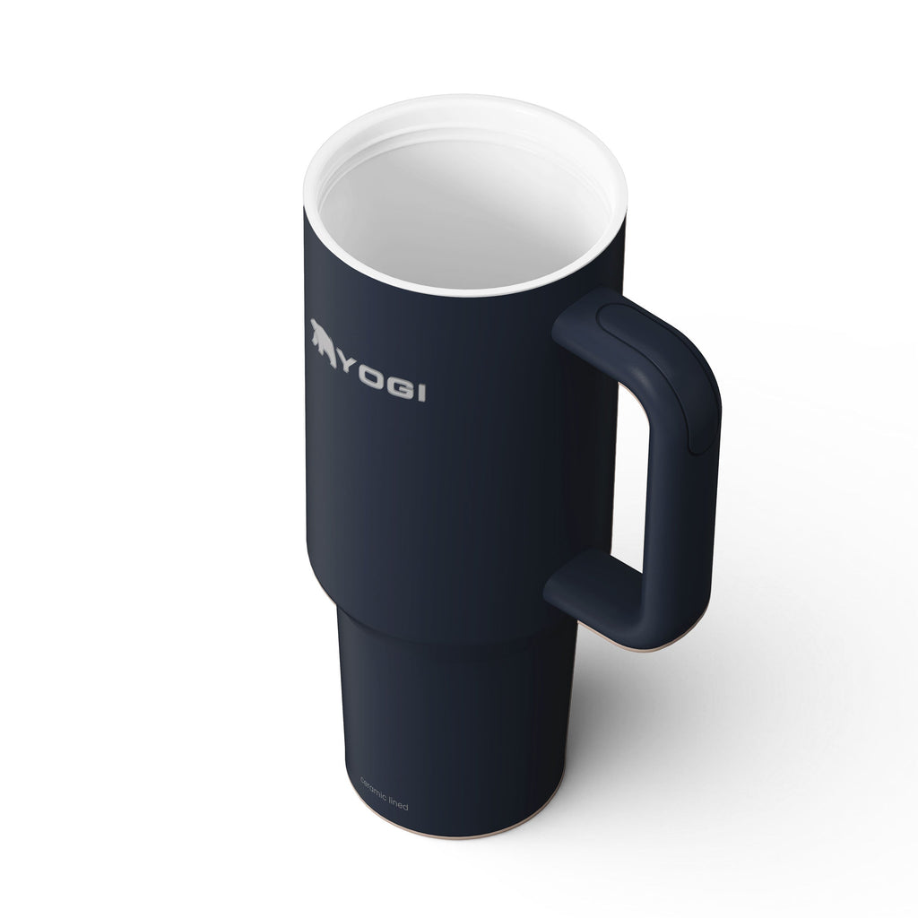 Ceramic-lined dark blue tumbler with side handle and white interior