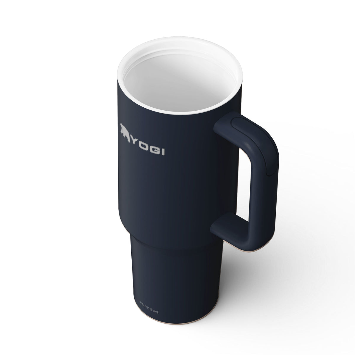 Ceramic-lined dark blue tumbler with side handle and white interior