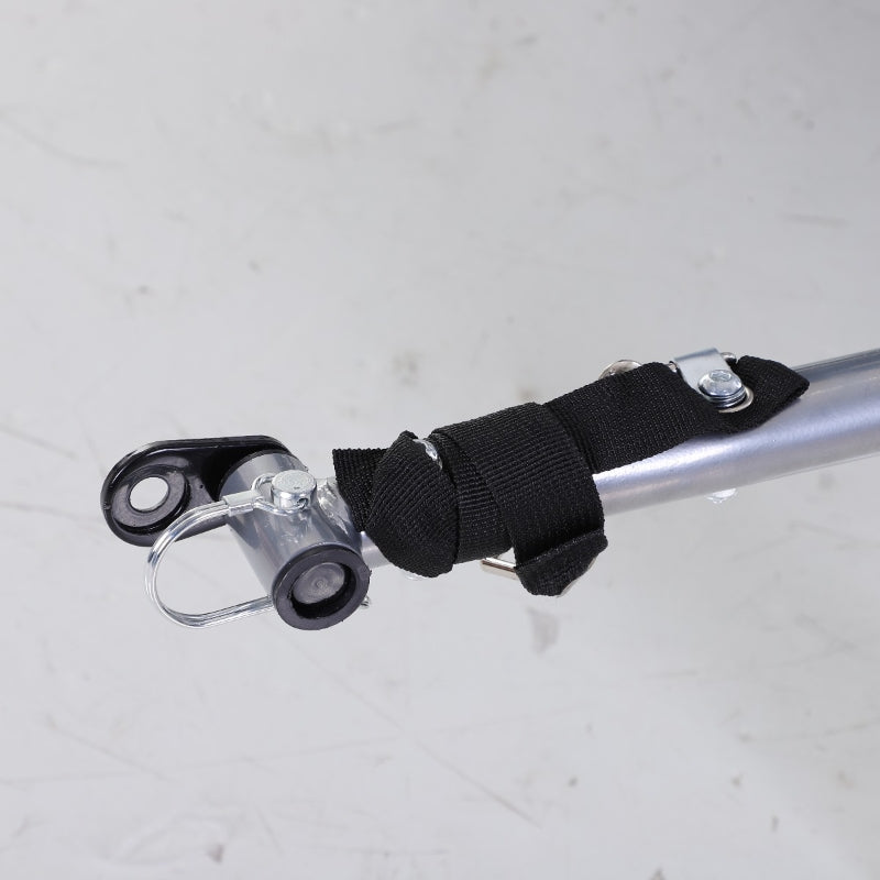 Pet trailer hitch latch hardware with black strap and silver coupling joint