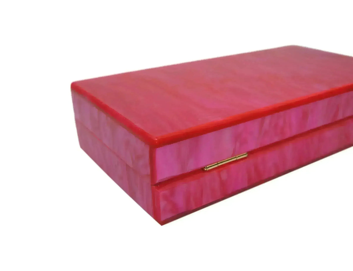 Pink acrylic box clutch with gold bar clasp on front flap
