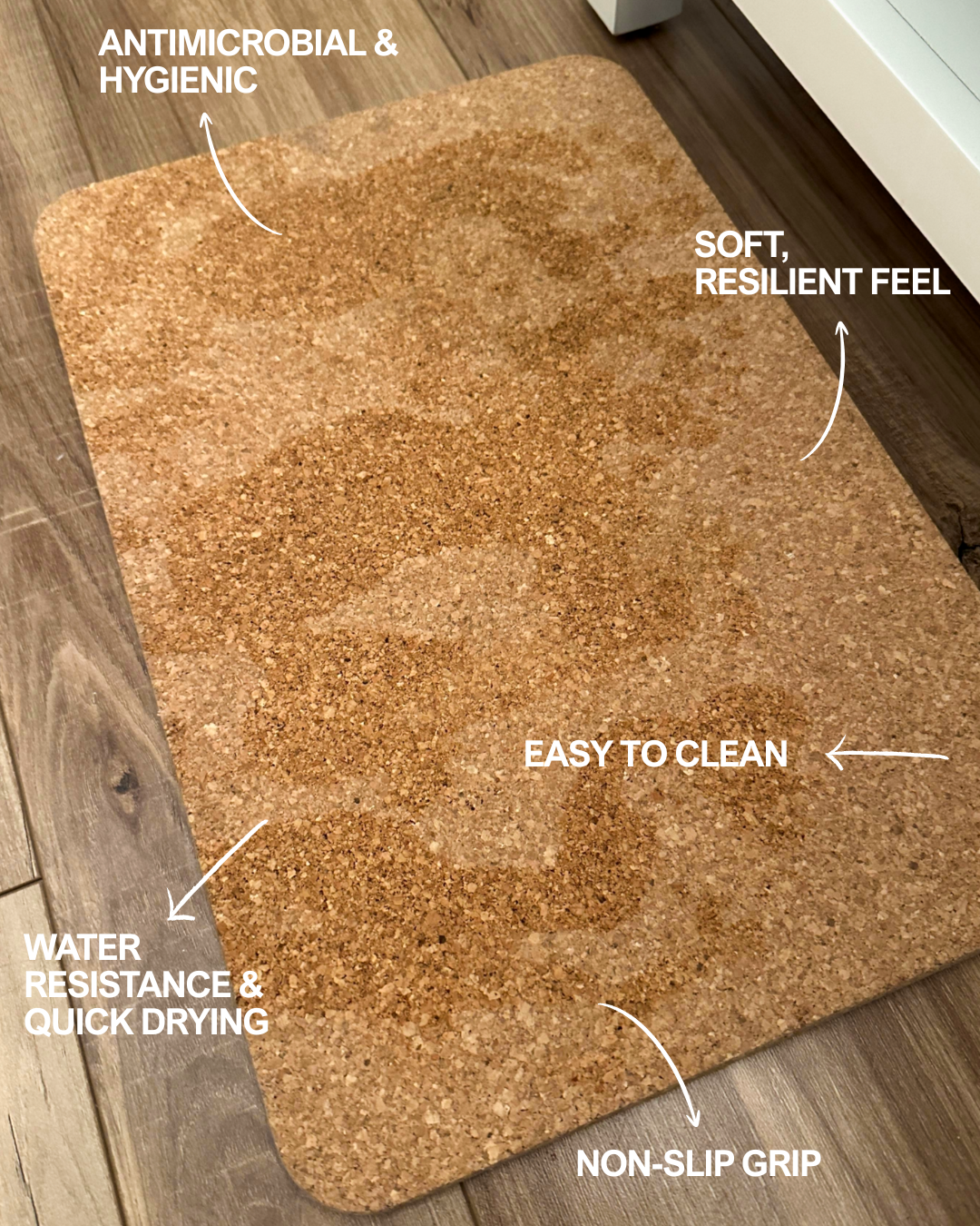 Natural cork bath mat close-up with speckled, textured surface and flat top