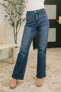 High-waist bootcut jeans in mid-blue denim with welt pockets and flared hem