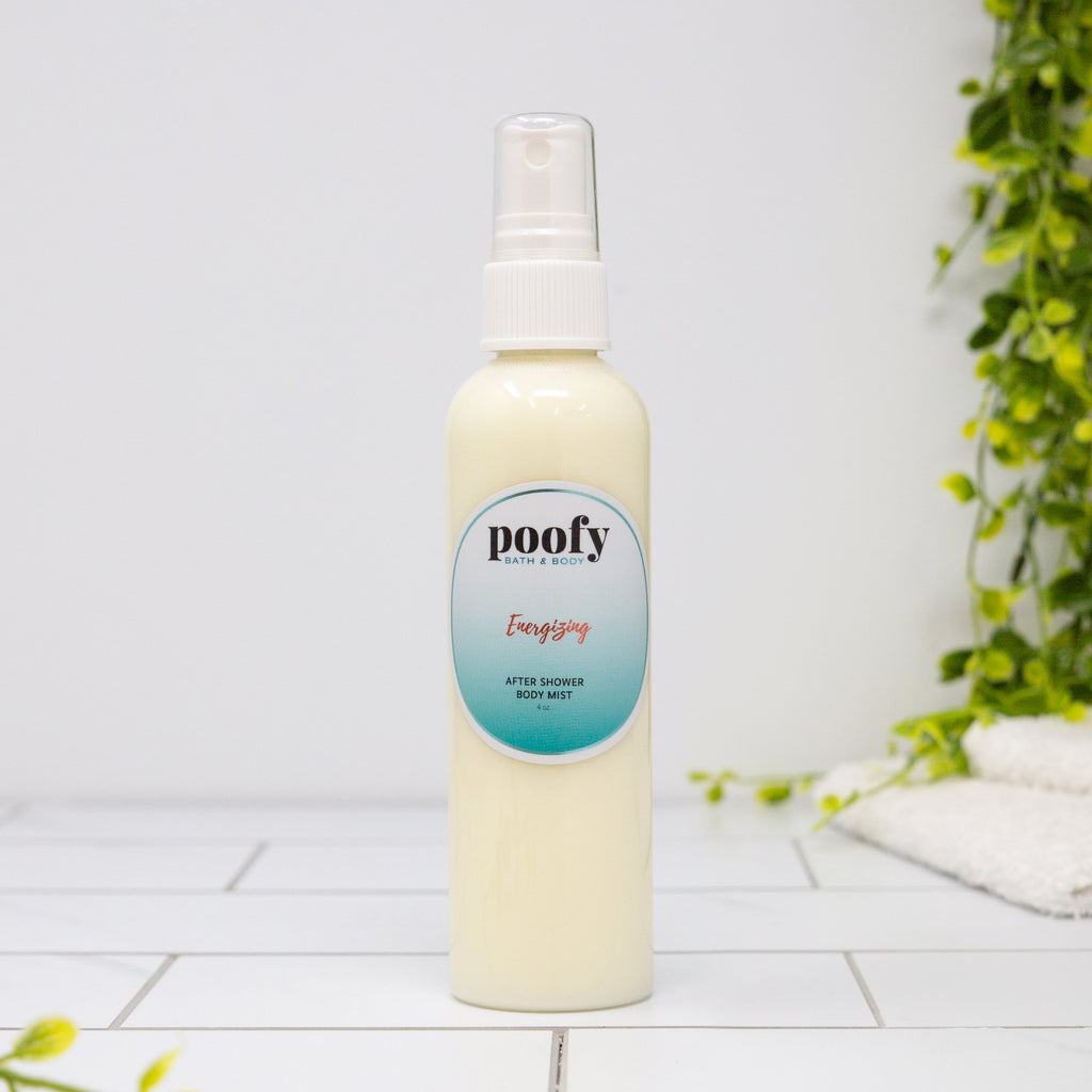 Poofy after-shower body mist bottle with white pump sprayer, cream-colored liquid.