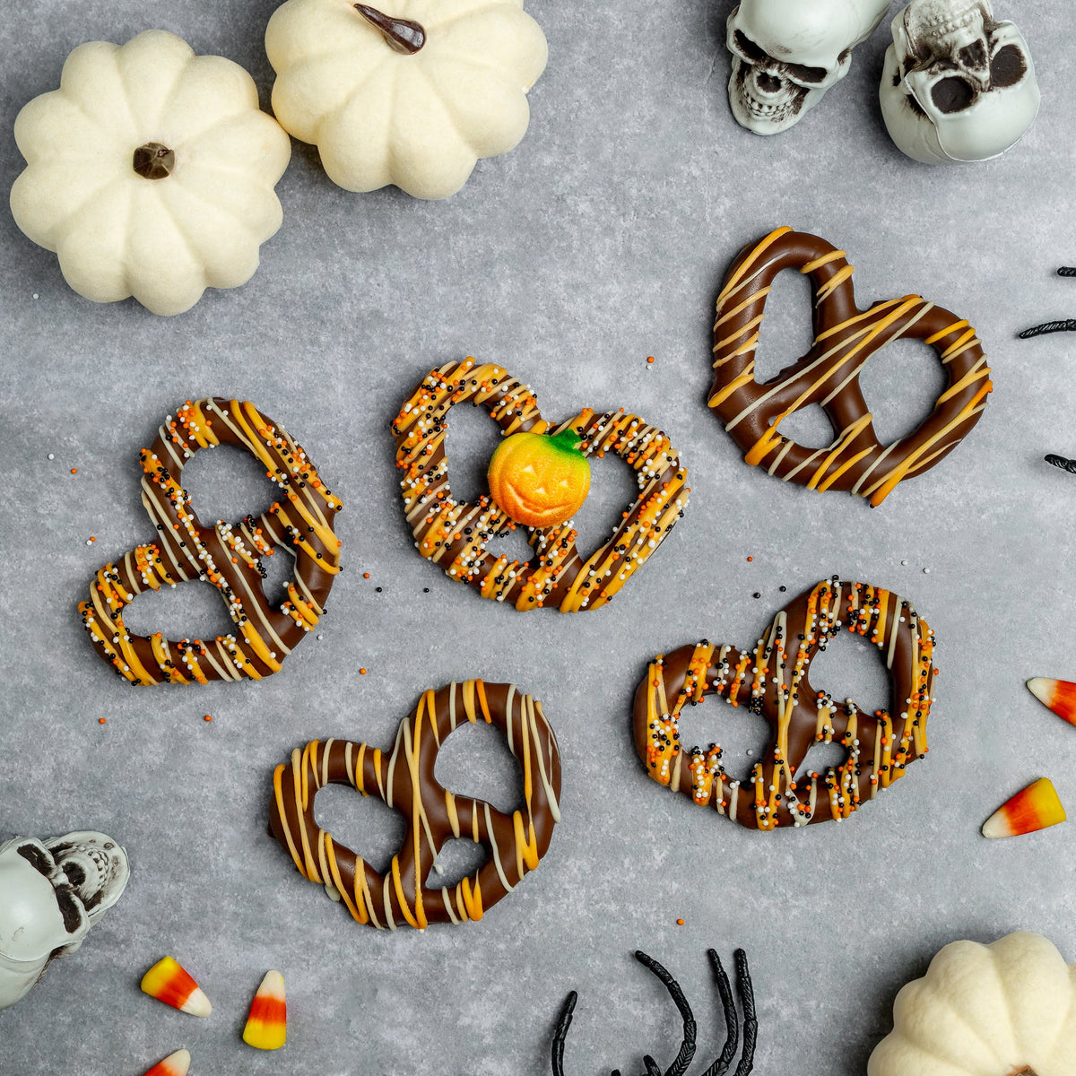 Halloween 5-piece pretzel gift box with five striped pretzels and orange candy drizzle