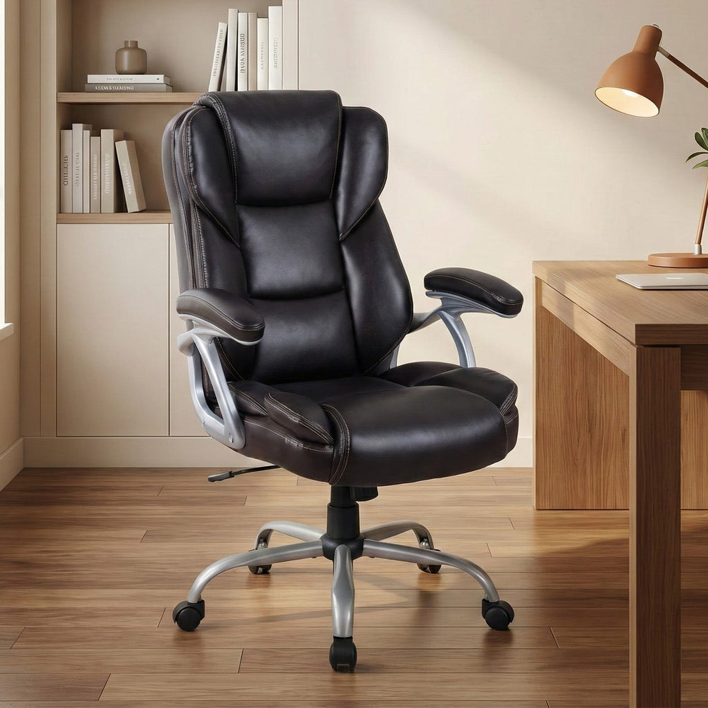 Black leather ergonomic office chair with padded seat, headrest, and curved armrests.