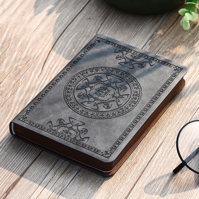 A6 leather mini notebook with embossed emblem on grey cover