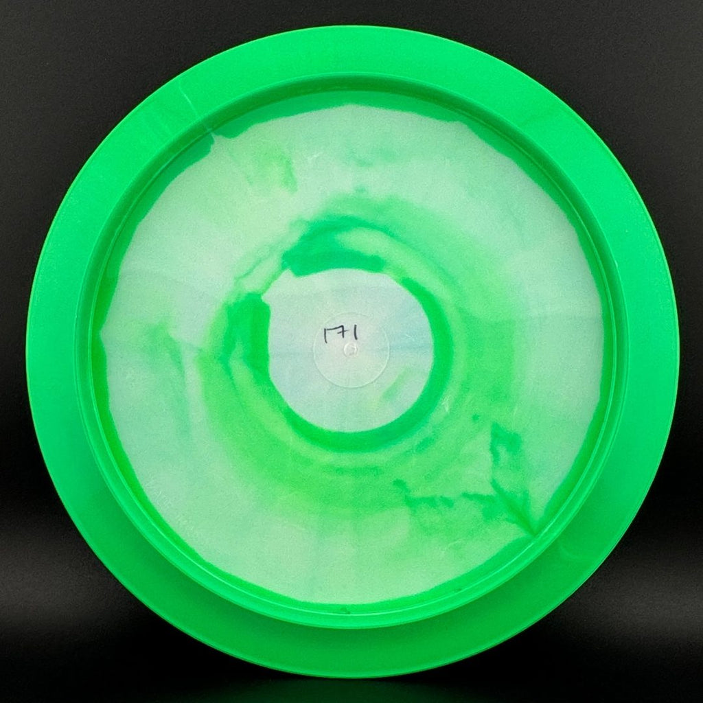 Green and clear disc golf disc with circular center and outer rim