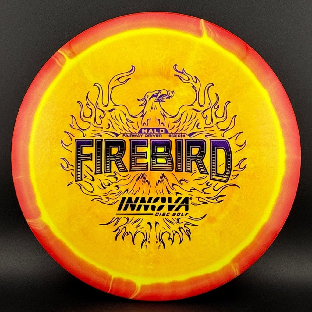 Disc golf driver with yellow face, red-tinted edge, dark “Firebird” graphic