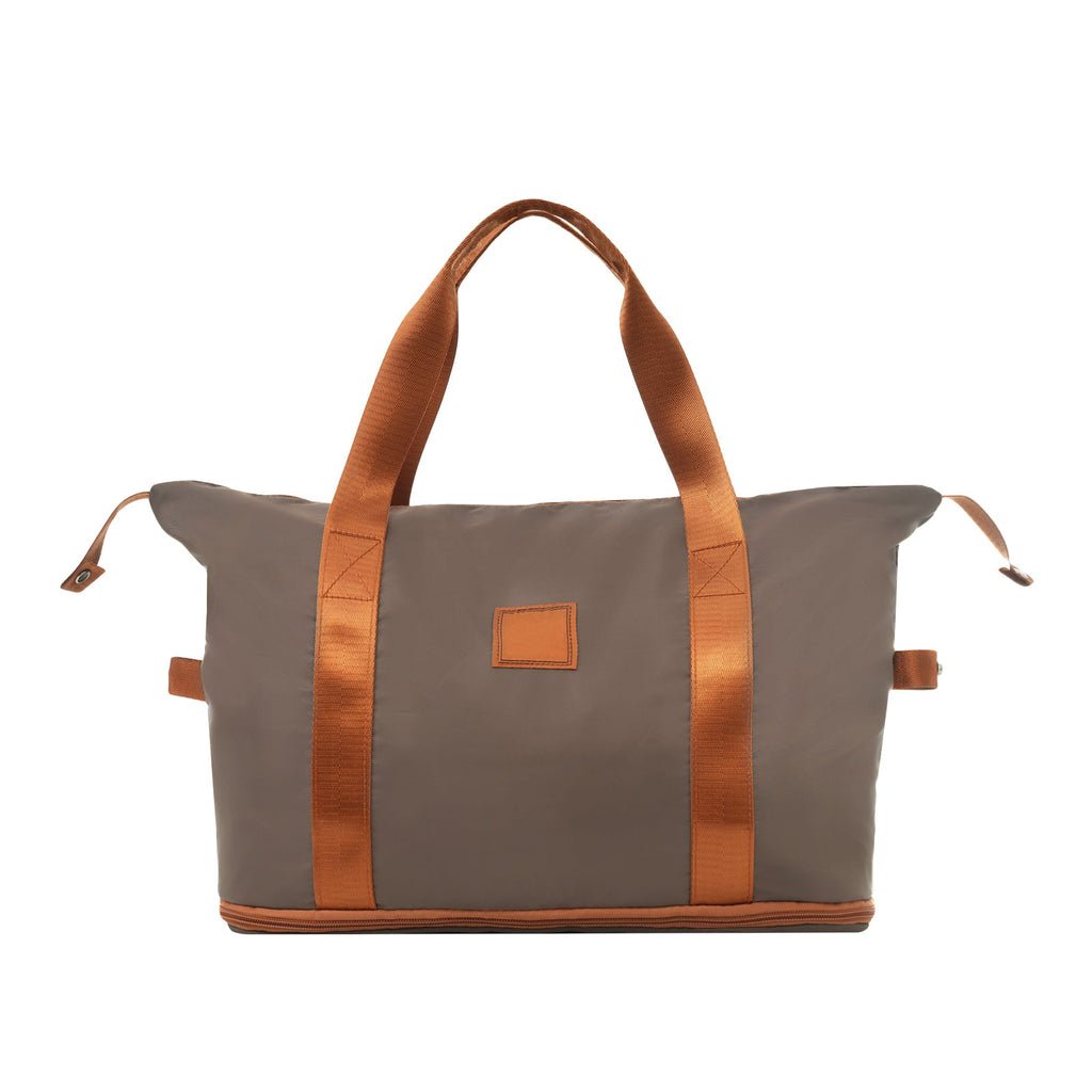 Grey and copper-brown canvas duffel bag with leather-look trim and top handles