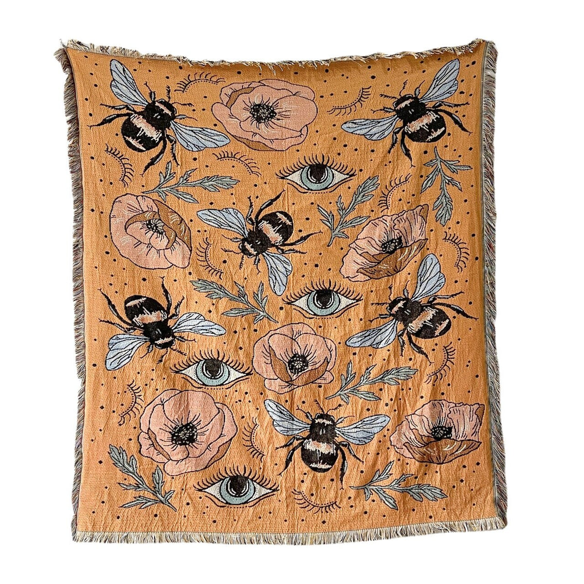 Floral and eye throw blanket in warm orange with black eye motifs and fringe