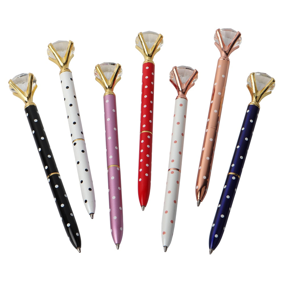 Gem-top ballpoint pens with gold faceted caps in black, white, purple, red, and navy