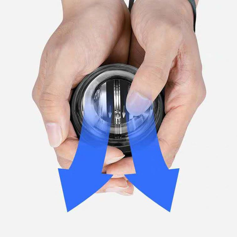 Hands gripping a blue wrist gyro ball exerciser, showing direction arrows