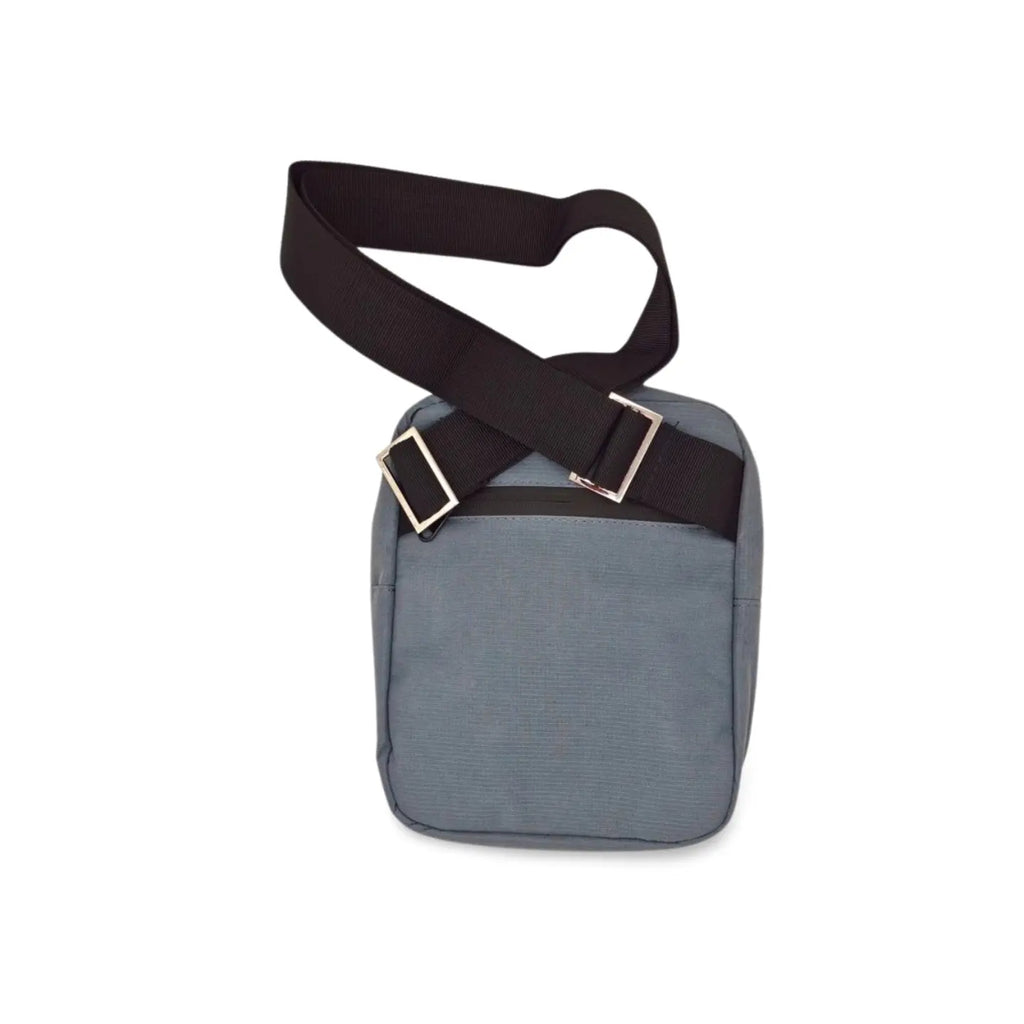 Blue-gray mini messenger bag with flap closure and adjustable shoulder strap