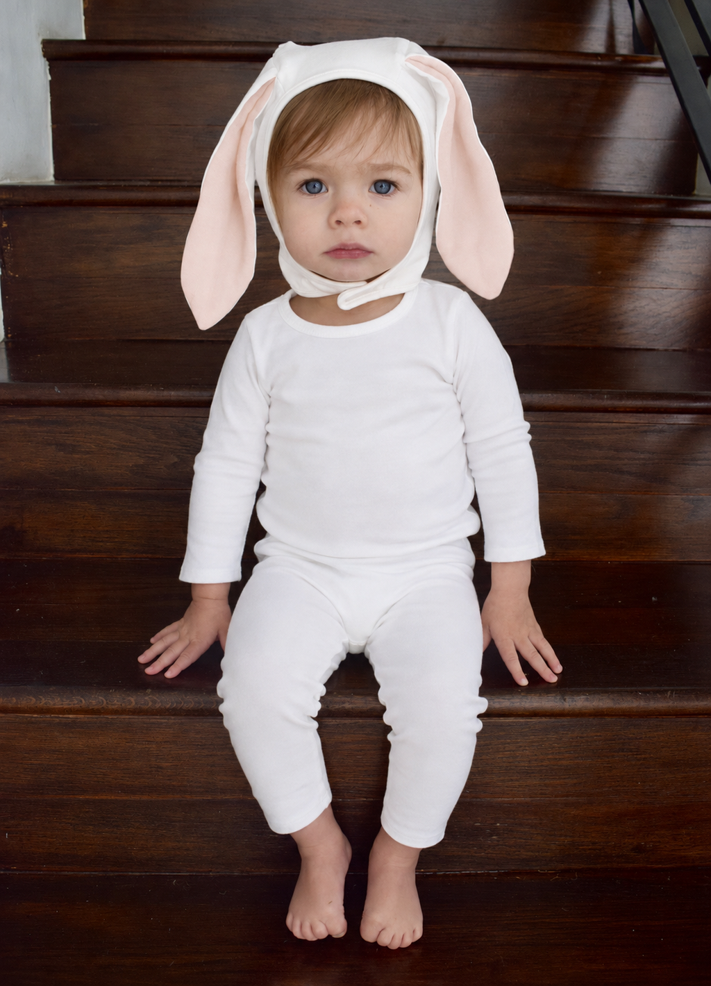 Baby ivory bunny costume with hood and long pink ears, standing pose