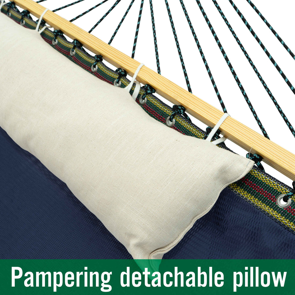 Detachable off-white pillow on navy hammock bed with rope clips and light wood spreader