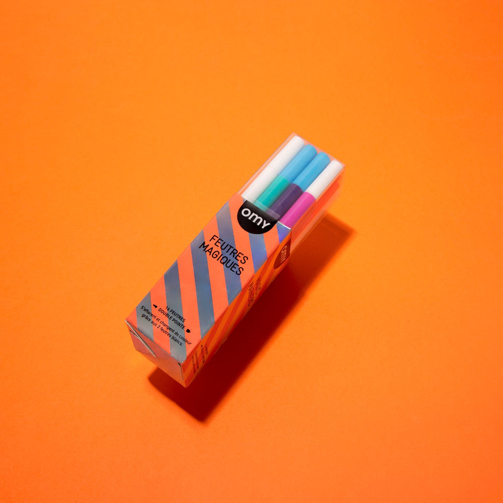 Magic marker box with colorful pens, angled view