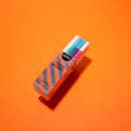 Magic marker box with colorful pens, angled view