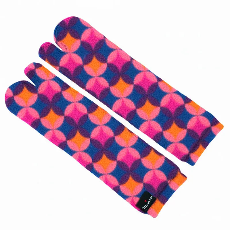 Fleece tabi sock pair folded flat, geometric diamond pattern in pink, blue, and orange.