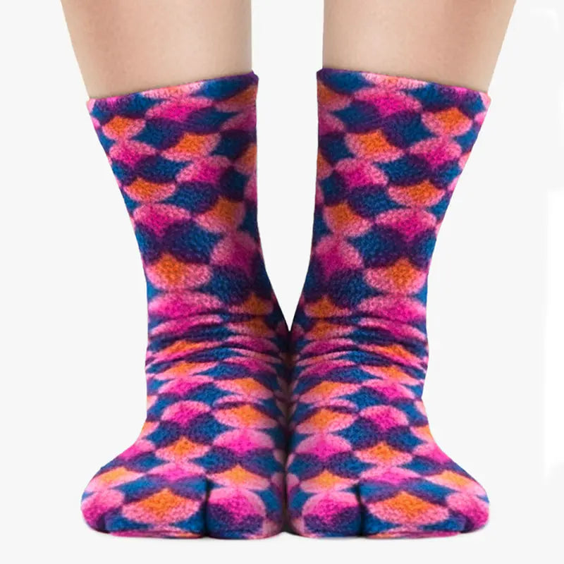Pair of Polar Feet fleece tabi socks, geometric diamond pattern in pink, blue, and orange.