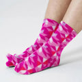 Kaleidoscope fleece tabi socks in magenta and pink geometric triangles, two-toe design