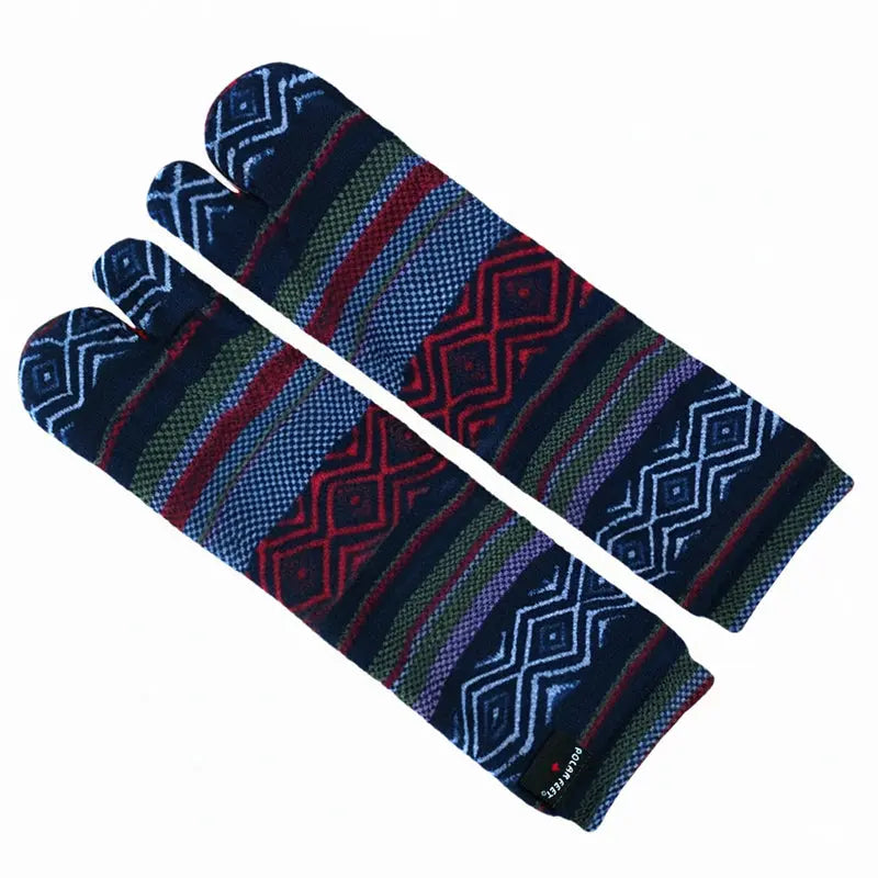 Fleece tabi socks laid flat, split toes, dark blue with red, green, and striped pattern