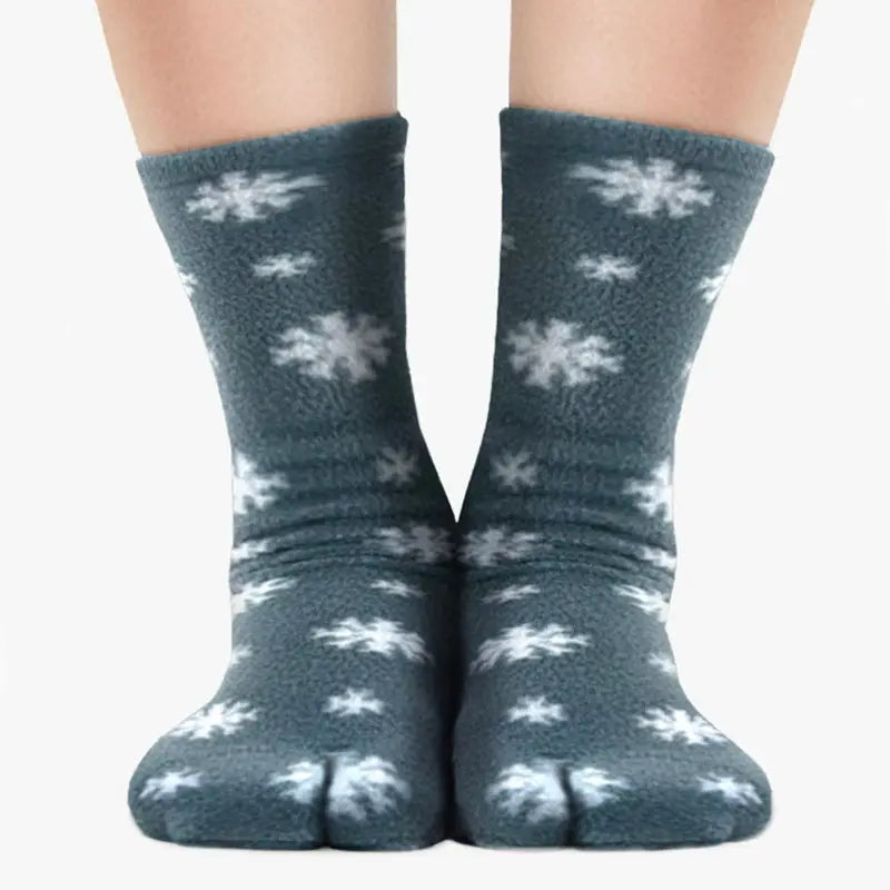 Pair of dark gray fleece tabi socks with white snowflake print, split-toe style