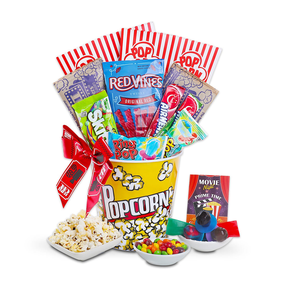Popcorn gift basket with assorted snack packs, striped wrappers, and two bowls of candy.