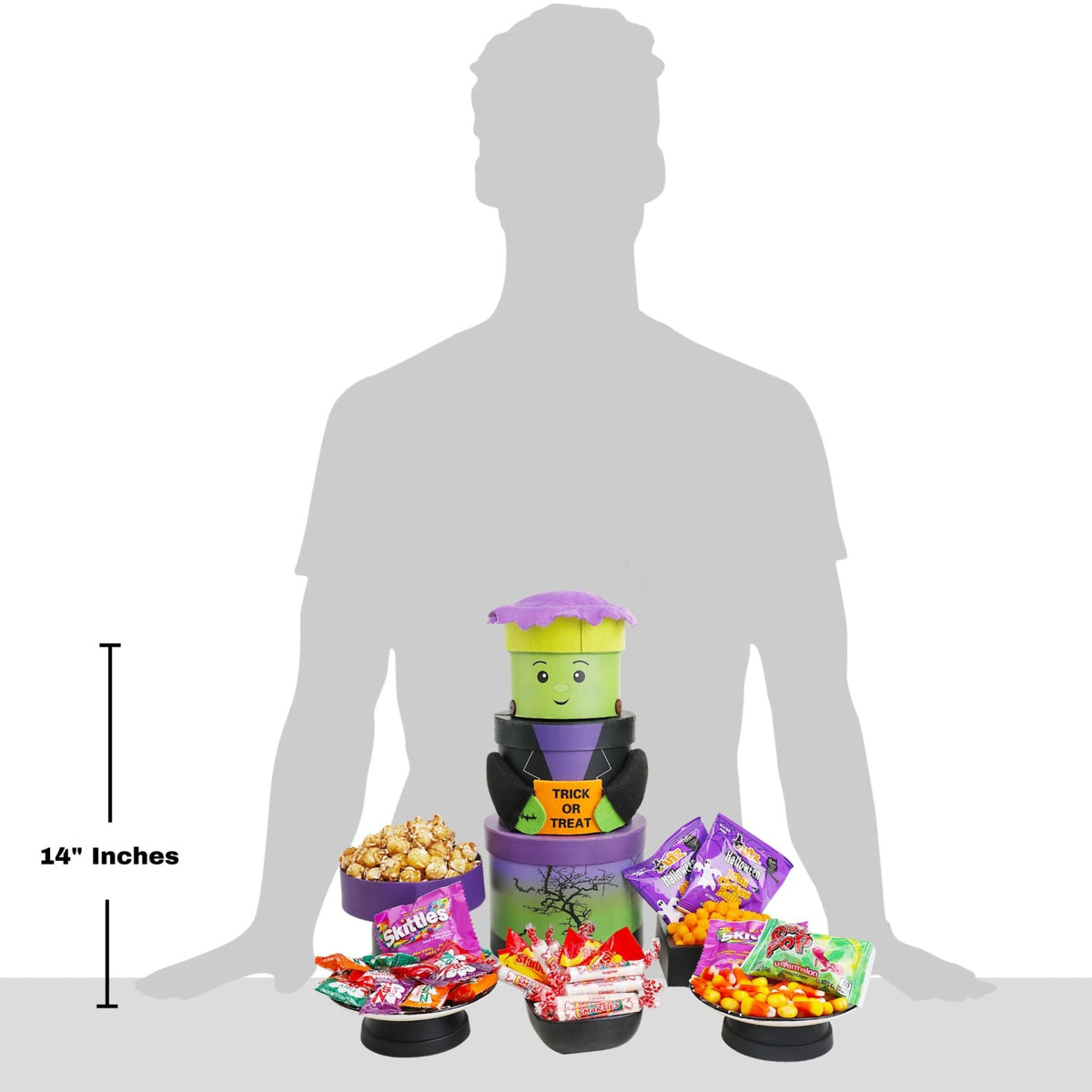 Halloween gift tower with green monster design, purple roof, and three candy cups for gifting