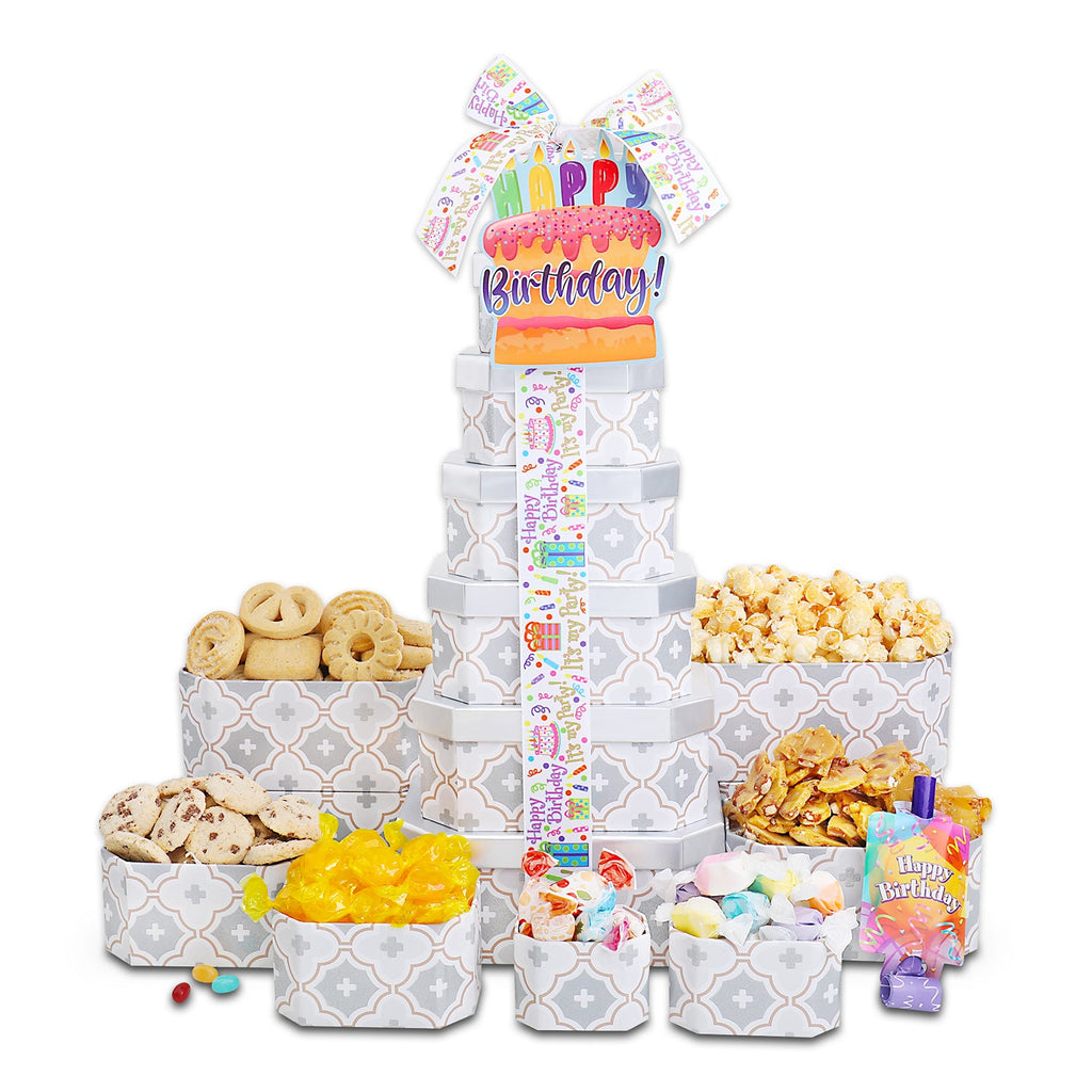 Birthday treat gift tower with gray patterned boxes, tall center tube, and assorted snack trays