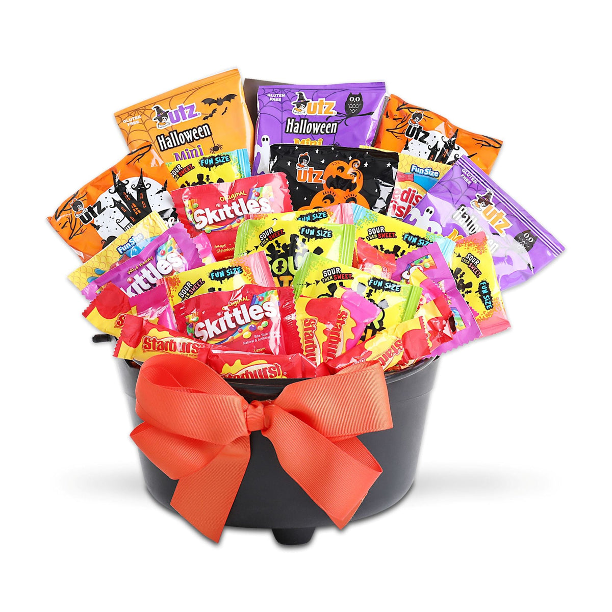 Halloween treat gift basket with assorted candy packs in black bucket and orange ribbon bow