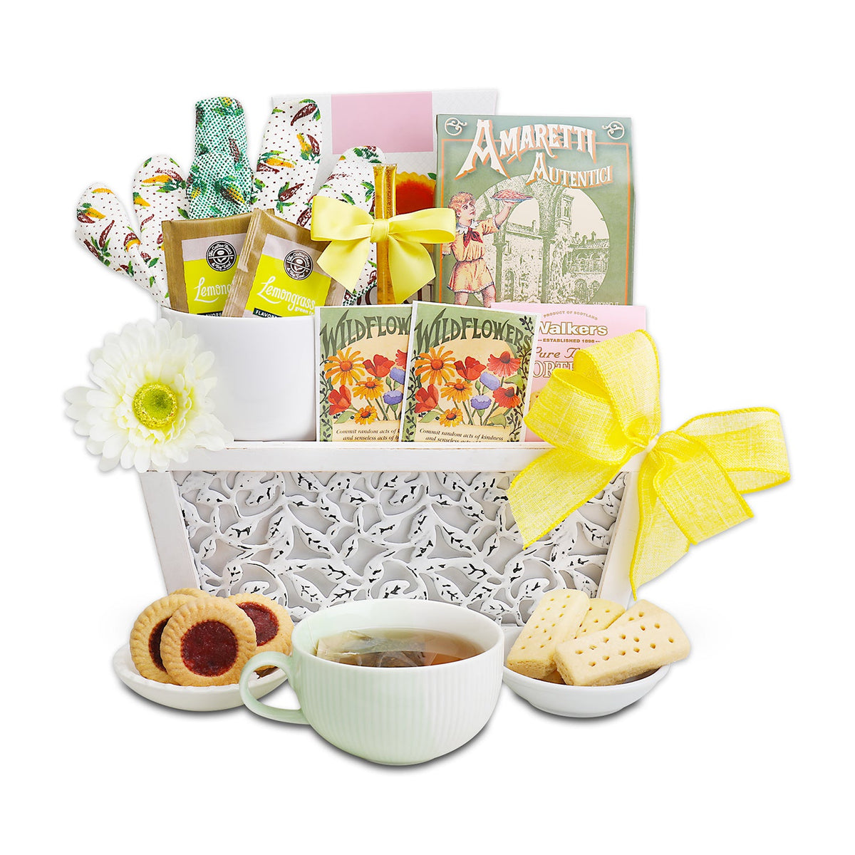 Tea and cookie gift basket with assorted packets, cup, biscuits, and yellow ribbon