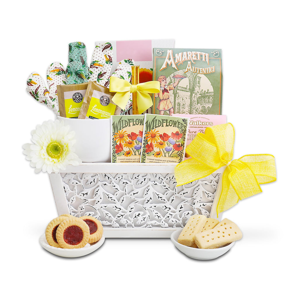 Tea and cookie gift basket with biscuits, cup, cookie tart, and yellow bow