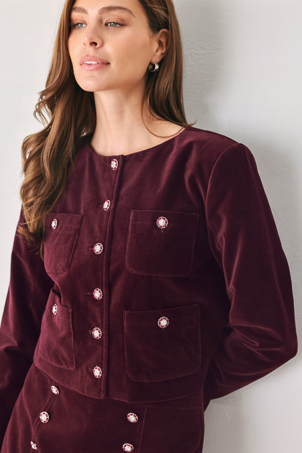 Burgundy velvet cropped jacket with jeweled buttons and chest patch pockets