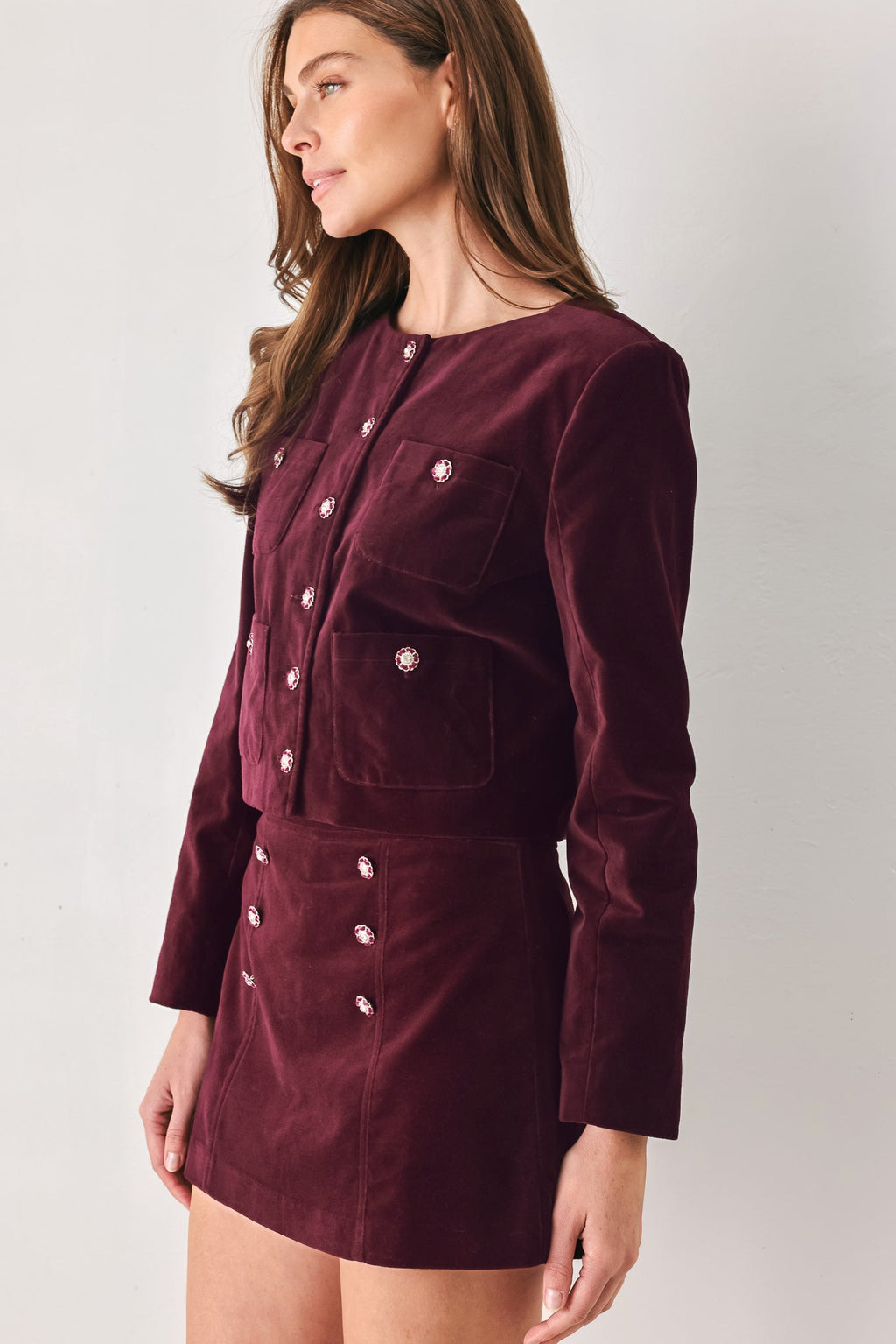 Burgundy velvet cropped jacket with jewel-button front and patch chest pocket