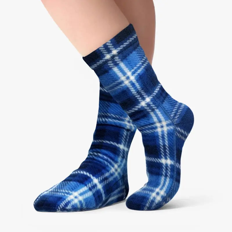 Blue plaid fleece crew socks on legs, snug stretchy fit.