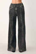 Black wash wide-leg denim pants with crossover waist front and belt loops